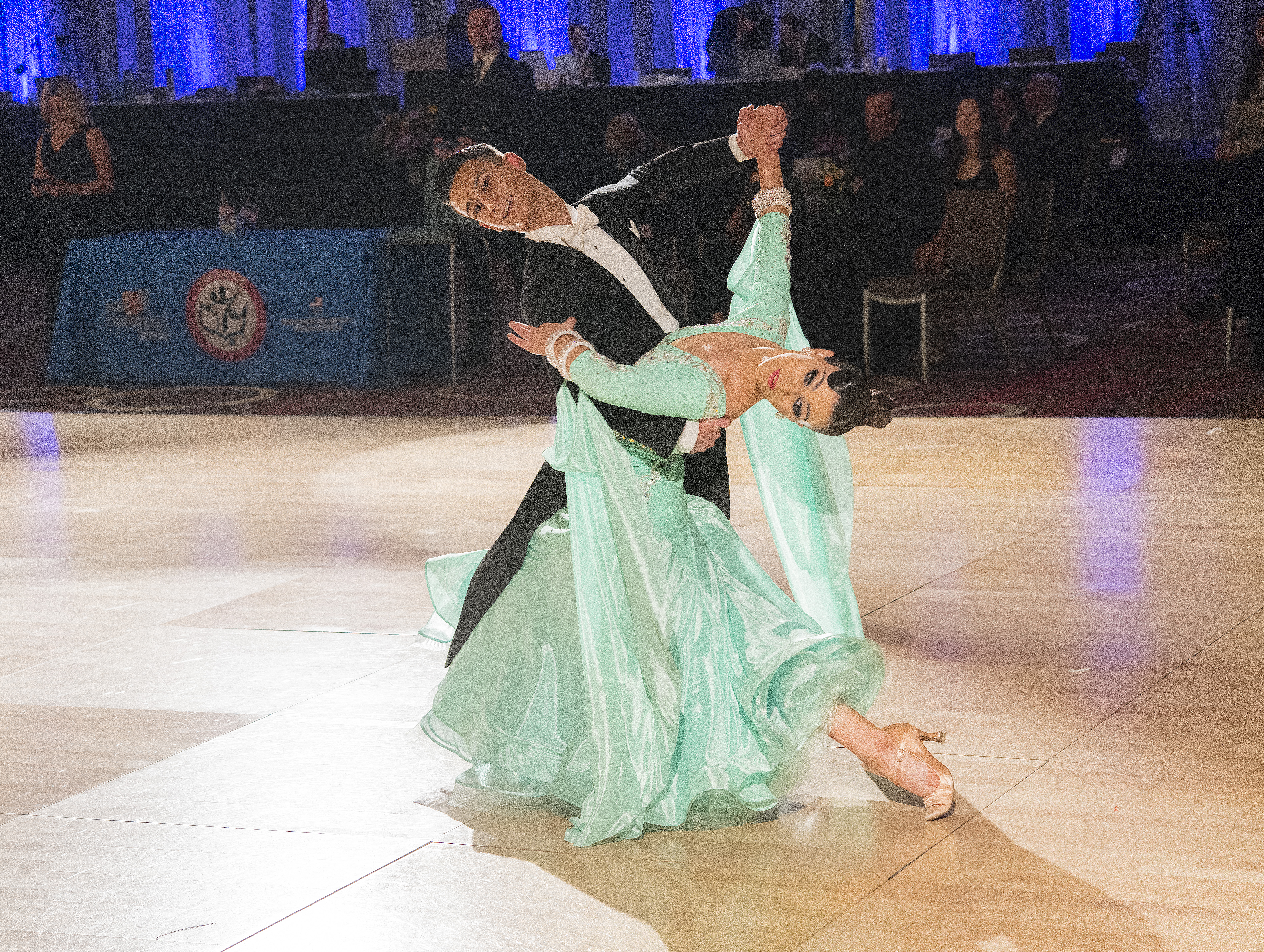 Christopher Affonso and Holly Hatleberg demonstrate a beautiful oversway in their Waltz. Christopher and Holly won Youth Championship Standard. Photo by Carson Zullinger.