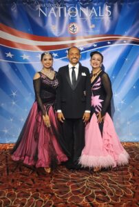 Ravi Narayan poses with his two partners – his wife Synthia Sumukti and daughter Prita Narayan, at the 2022 Nationals. Both partnerships dance four styles. Photo courtesy of Synthia Sumukti.